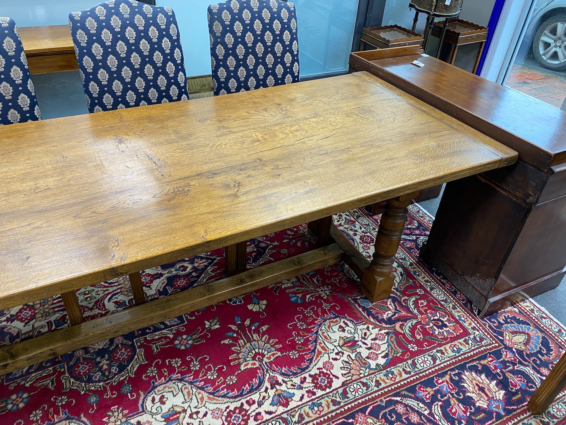 A large 18th century style rectangular oak refectory dining table, length 296cm, depth 89cm, height 76cm